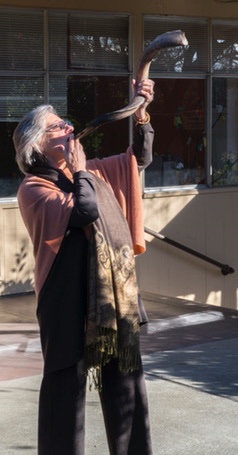Illana sounding a shofar